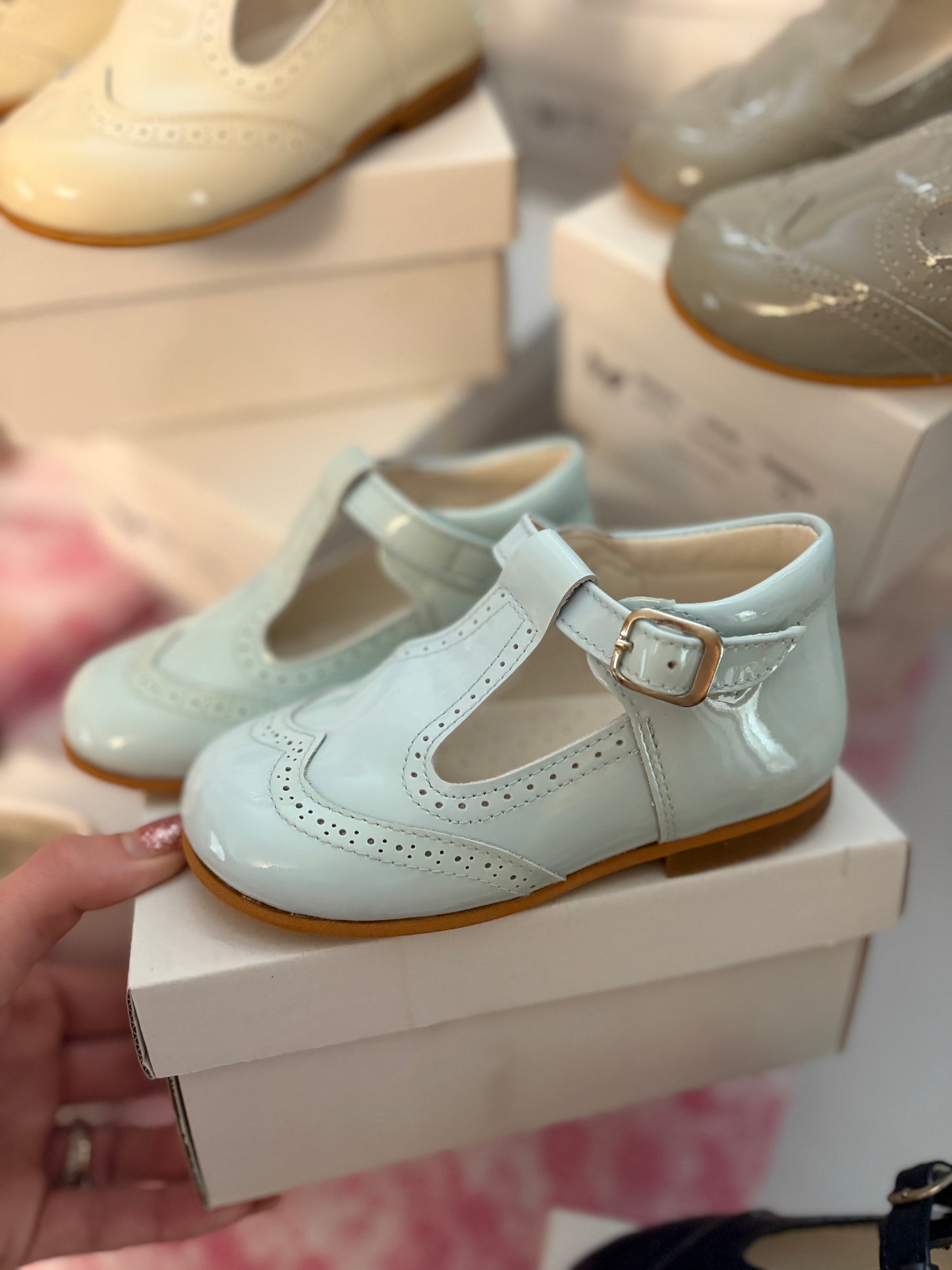 Blue t bar patent shoes